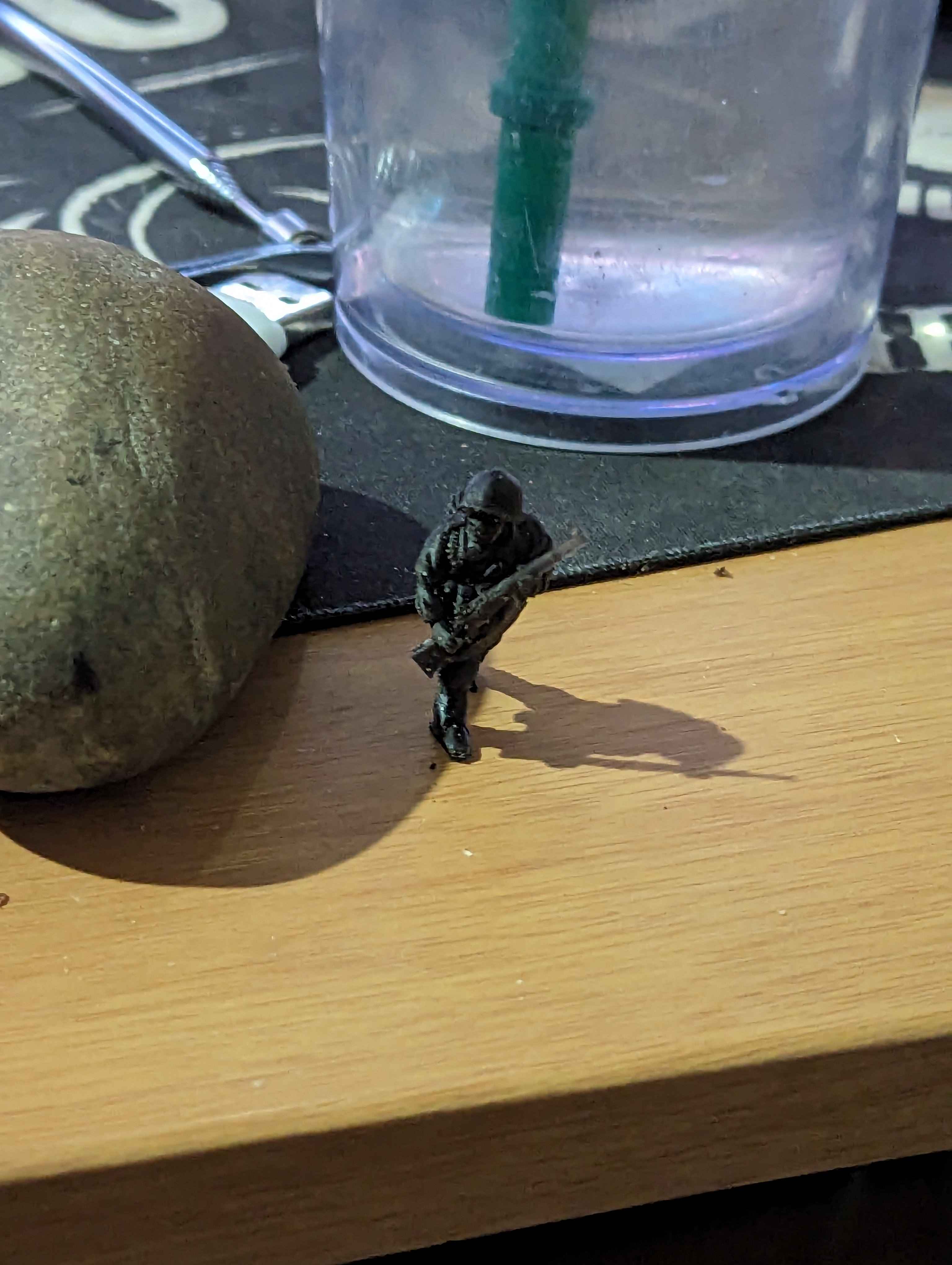 A little WW2-era soldier printed in black resin