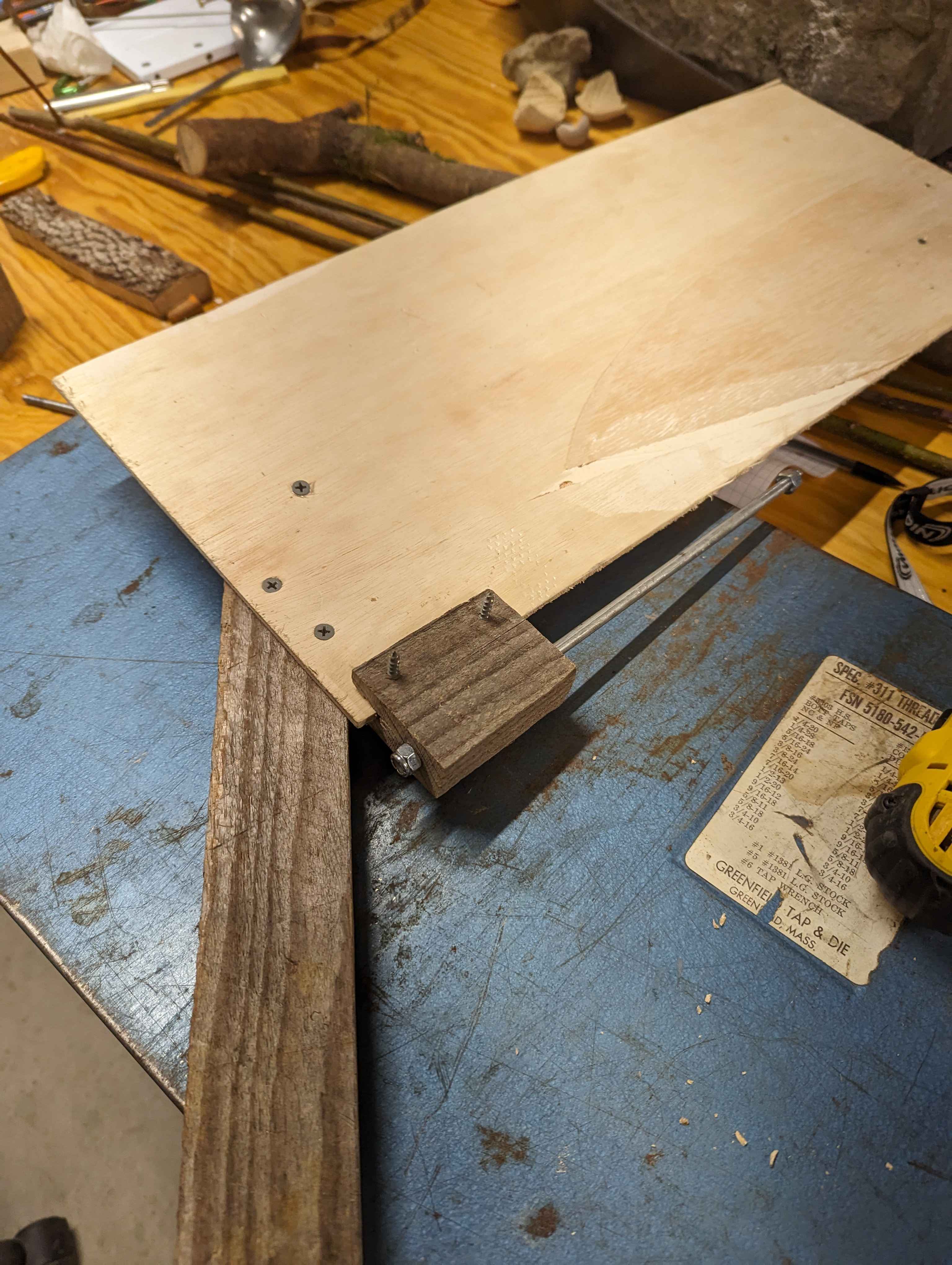A wooden rudder closeup, detailing the pivot